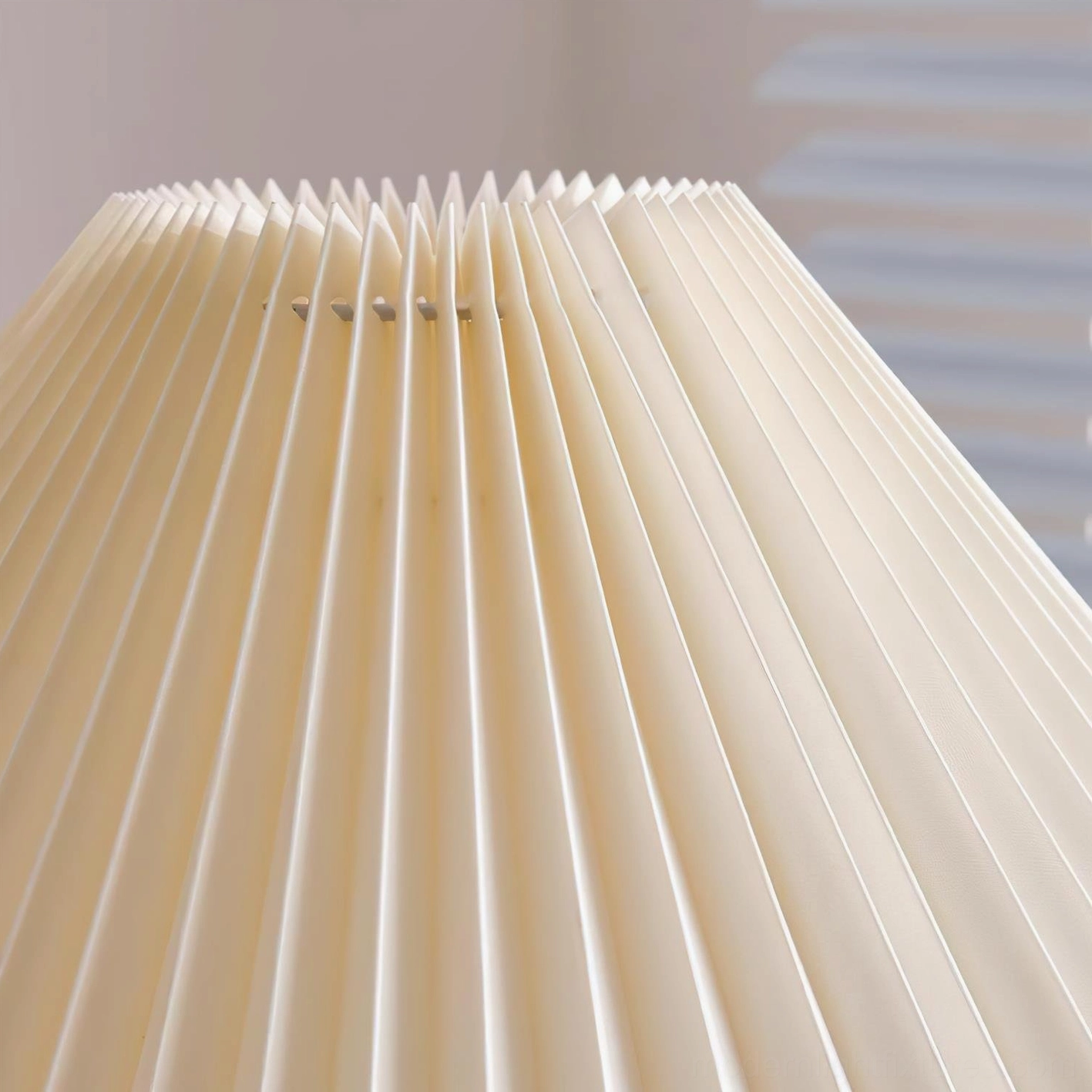 Modern pleated table lamp detail view showing fabric pleats and wood base construction quality