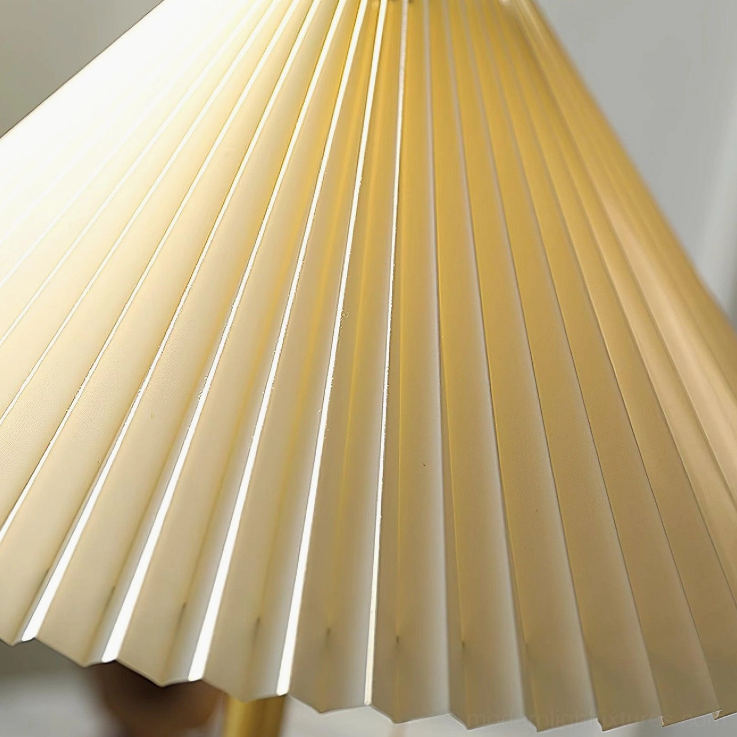 Contemporary pleated fabric table lamp adding elegant warmth to Scandinavian-style interior with natural wood tones