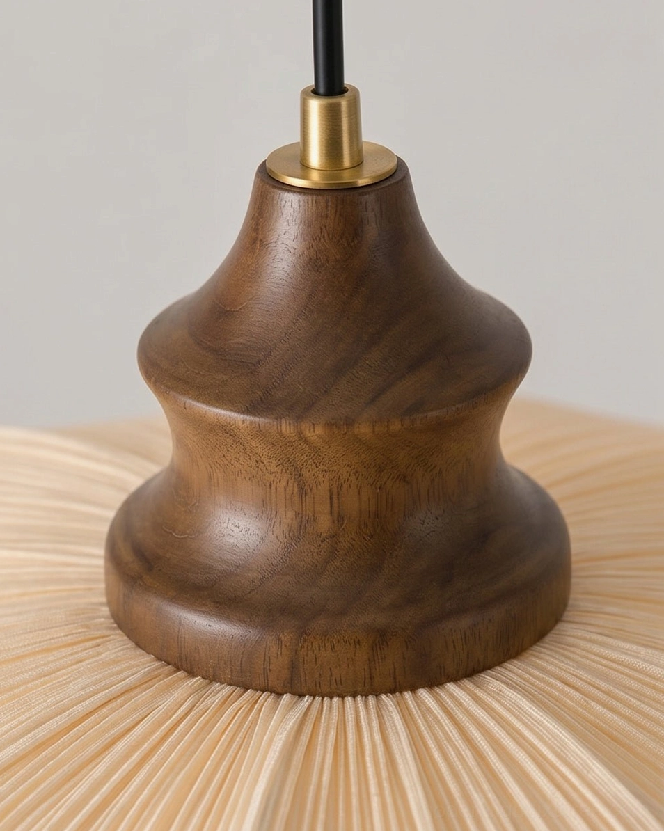 Pliora pleated fabric pendant light casting warm soft ambient glow through layered scalloped tiers