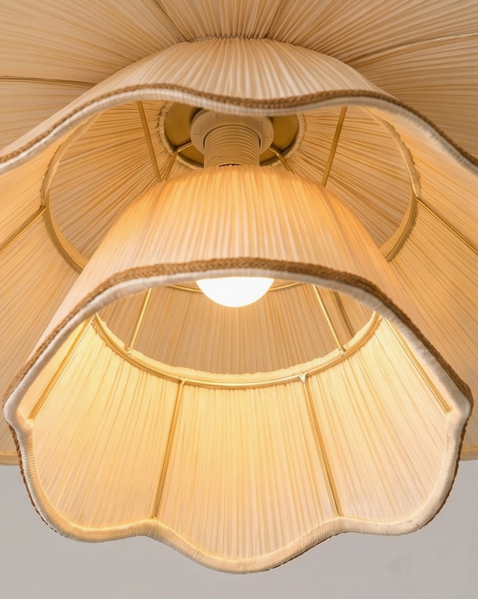 Pliora tiered pendant light showing bottom view of pleated fabric shade with scalloped hem design