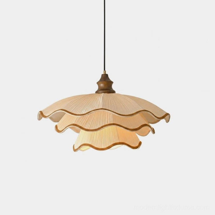 Pliora tiered scalloped pleated pendant light with cream fabric and brown contrast piping, shown in studio front view with white background