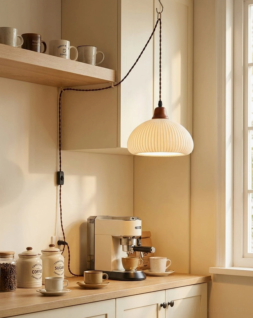 Ribbed ceramic pendant light hanging above kitchen counter with kitchenware and coffee station setup