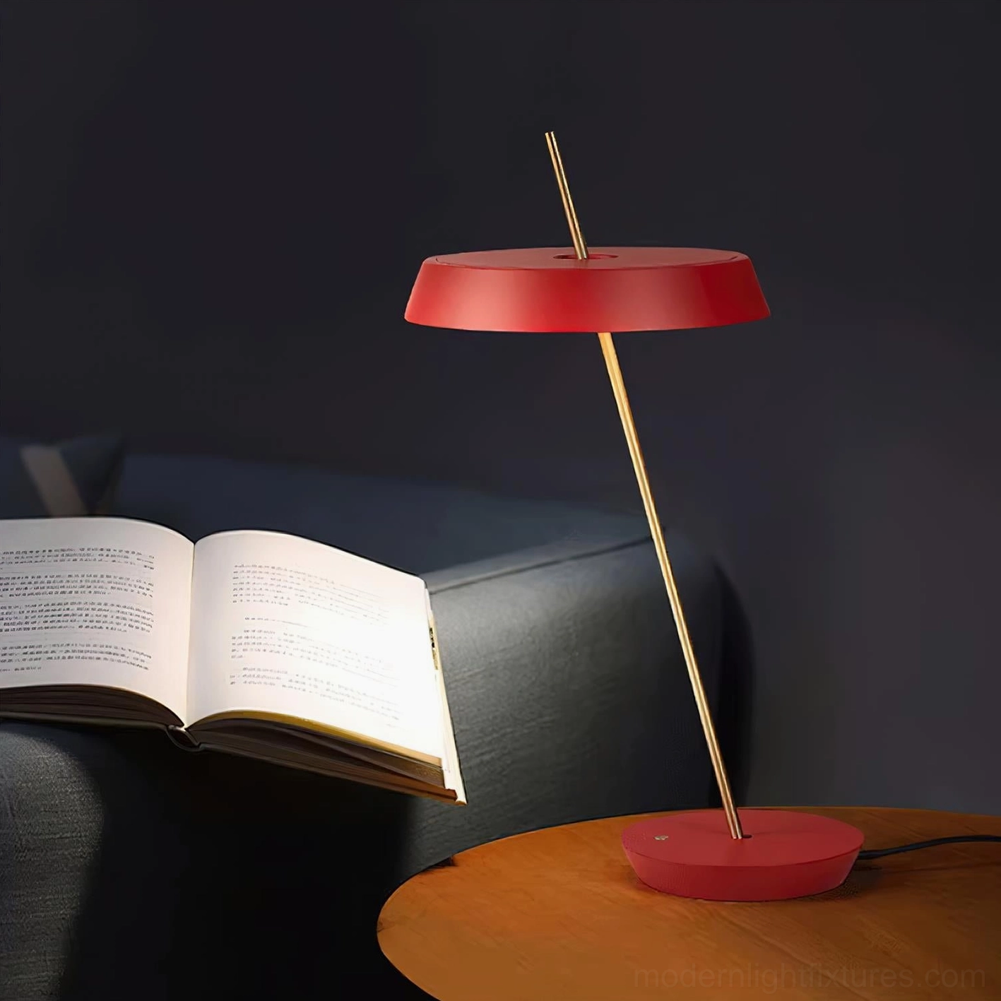 Gold Poldina minimalist table lamp with warm brass tone integrated LED illumination detail