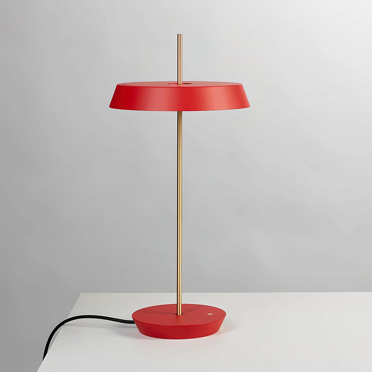 Red Poldina contemporary table lamp front view showcasing sleek brass golden support stem