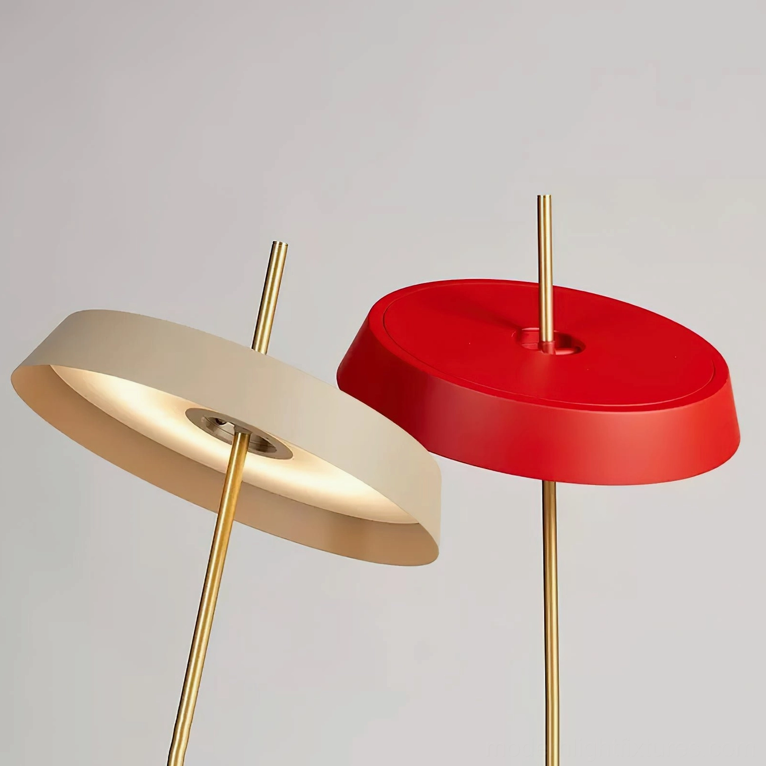 Red Poldina contemporary disc table lamp demonstrating modern minimalist design principles and form