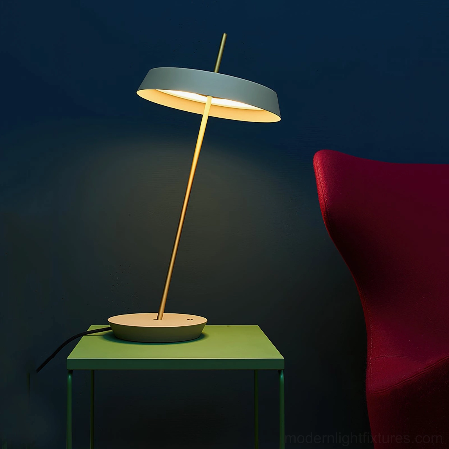 Two-tone Poldina disc table lamp with grey shade beige base and brass golden stem on green side table