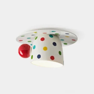 Modern polka dot ceiling light fixture with white ceramic base, colorful multicolored dots, and red accent ball in studio close-up