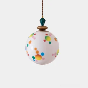 Celora polka dot glass pendant lamp with colorful floating dots on white studio background, frontal view
