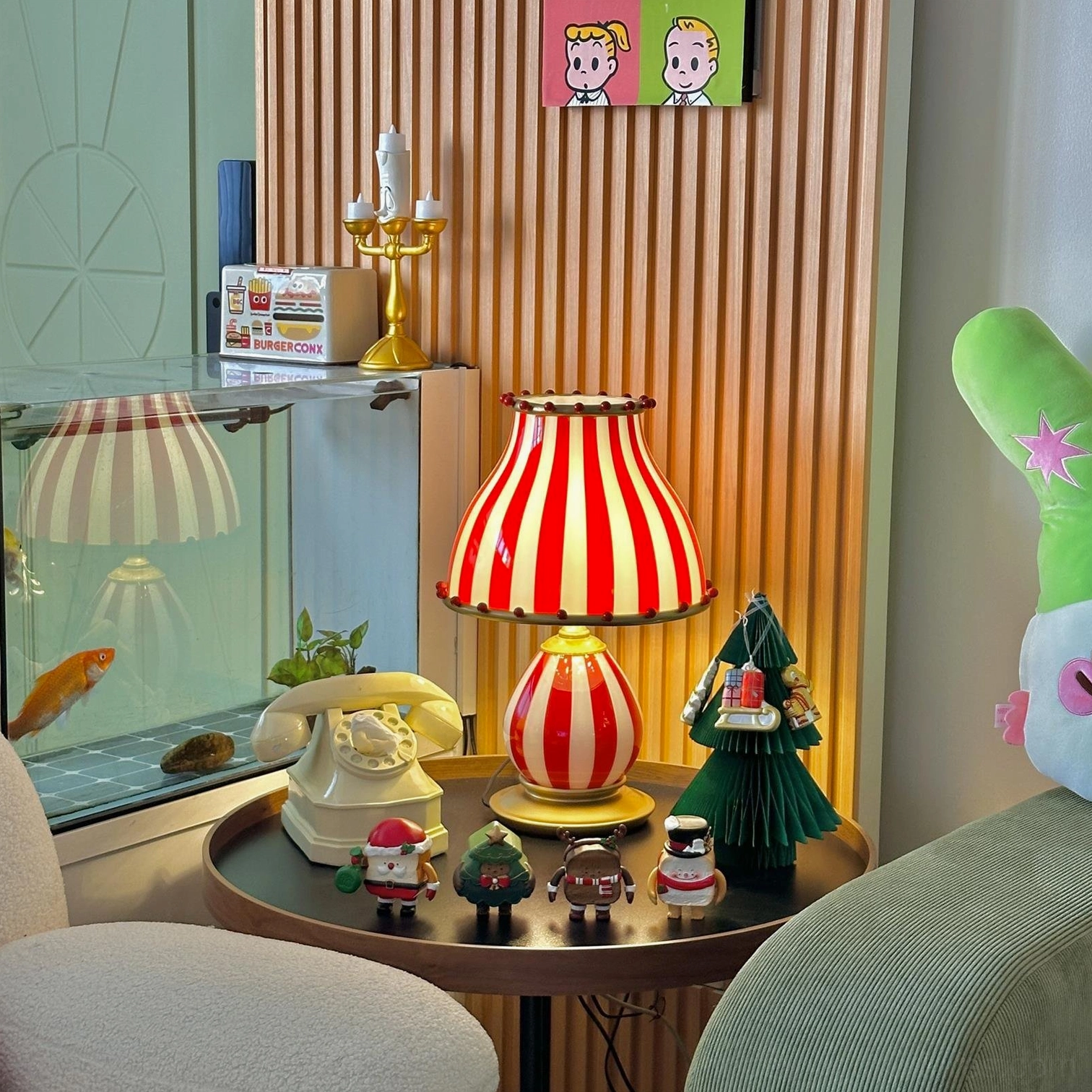 Pom-pom embellished circus table lamp creating spectacle of light