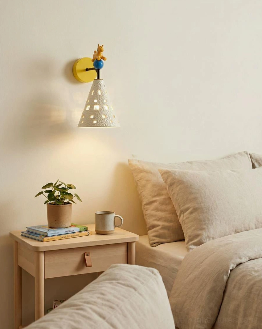 Pony wall sconce mounted beside bedroom bed with warm ambient lighting in kids bedroom