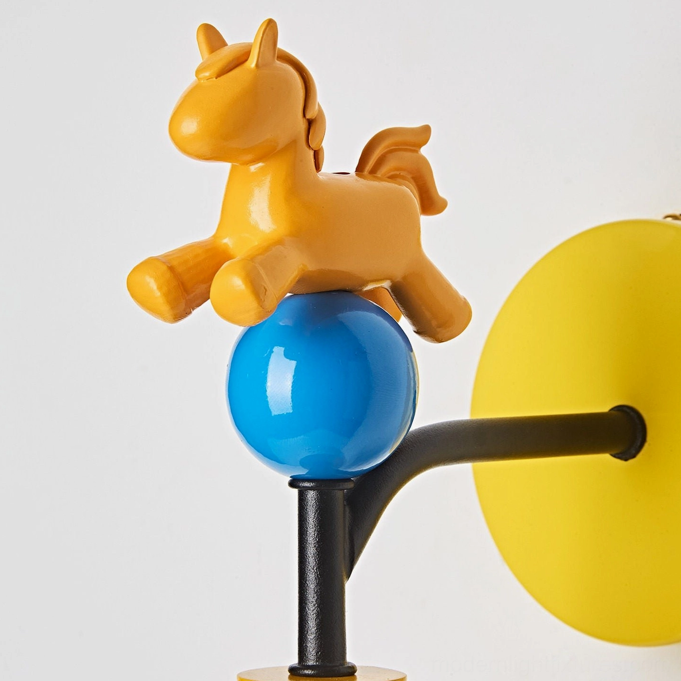 Pony wall sconce mounted above children's homework desk in playful kids study room