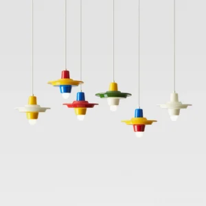 Collection of six color variants of modern pop pendant lights hanging in row, showing all available colorways including primary stacks and cream options