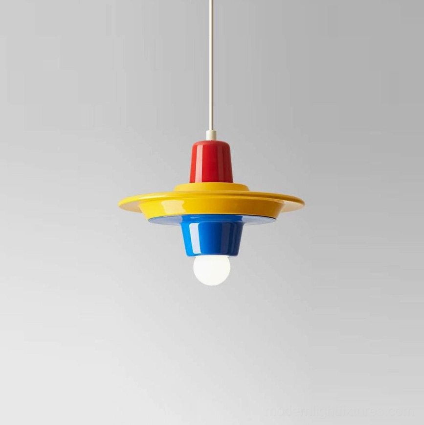 Red, yellow, blue color-blocked stacked disc pendant in primary stack order, hanging view showing playful pop art silhouette
