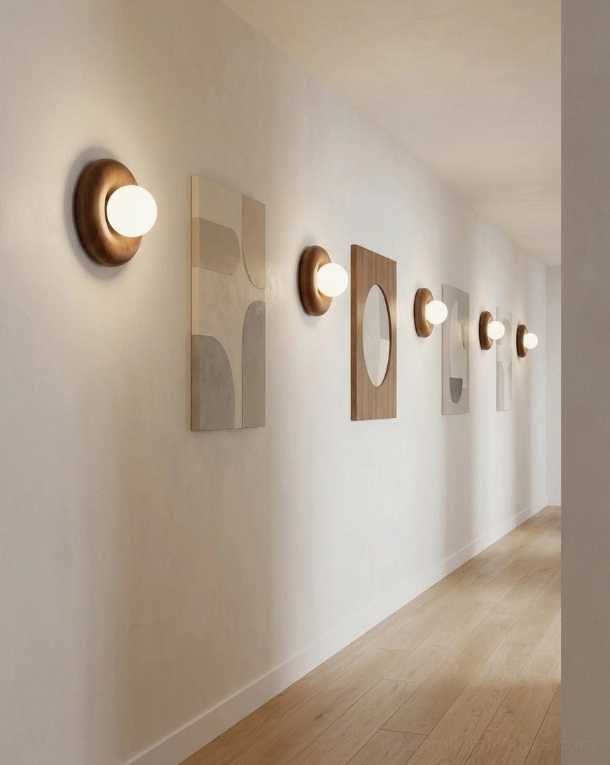 Pair of Pop wall sconces in walnut finish mounted along hallway corridor, minimalist modern interior lighting design