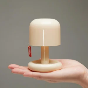 Rechargeable Mini Mushroom Lamp held in palm - Overhead view showing compact size