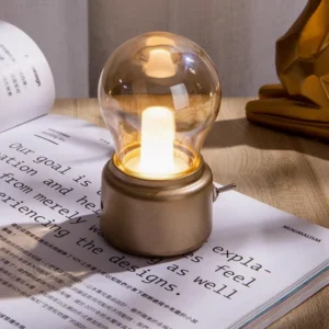 Compact USB desk lamp with warm LED glow on home office workspace with open book
