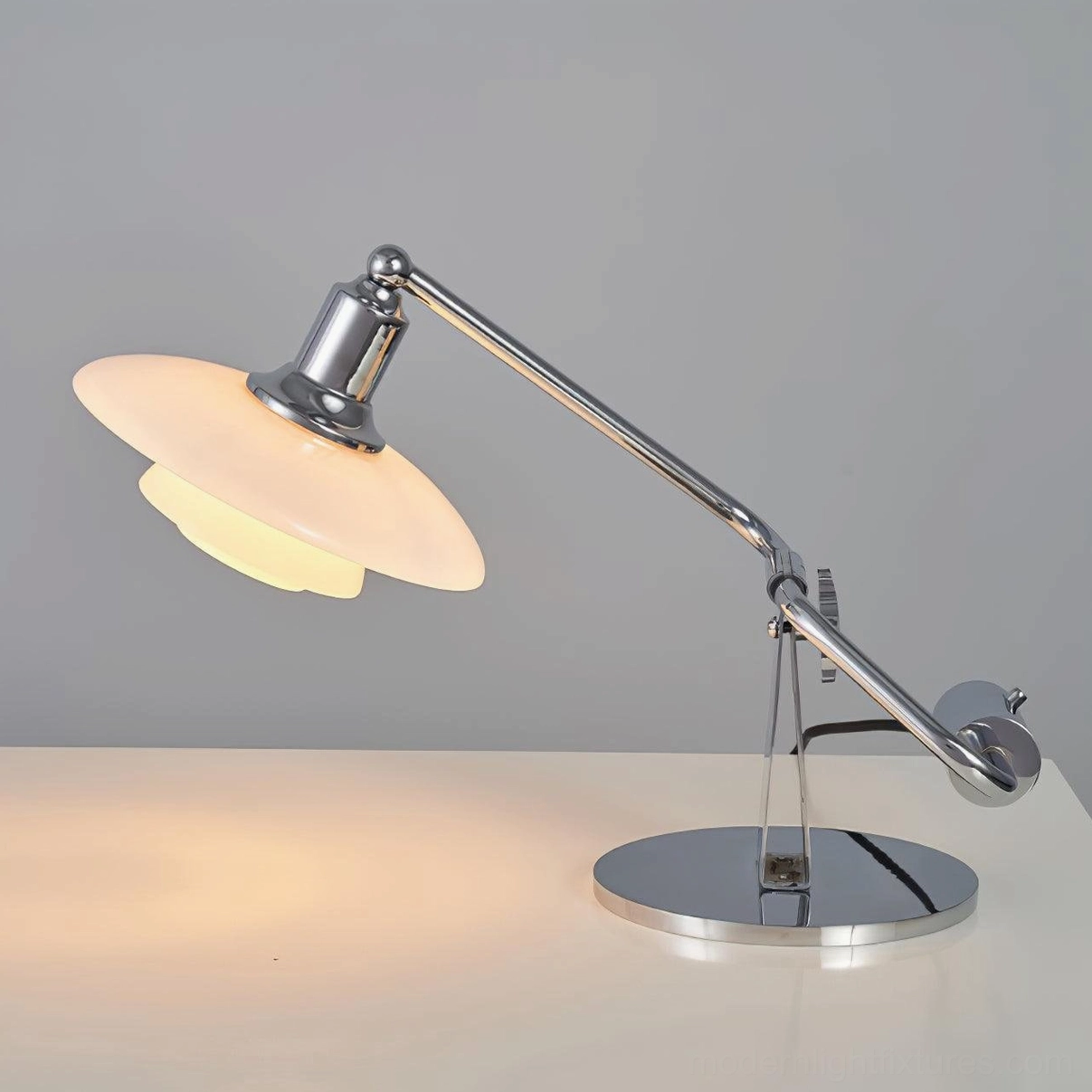 Poul modern table lamp chrome and white variant shown in contemporary home setting