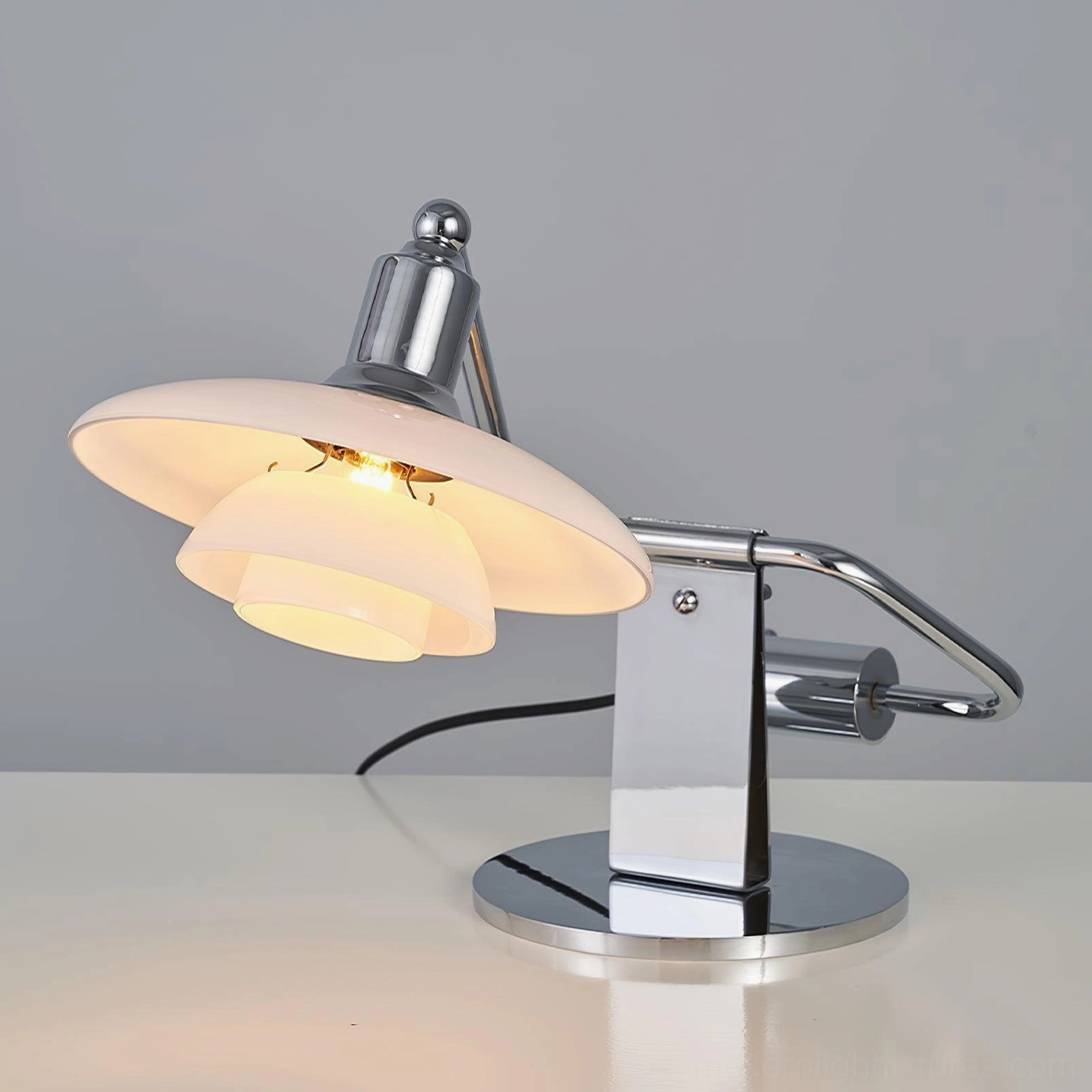 Poul contemporary desk lamp with chrome metal finish and soft white glass shade unlit