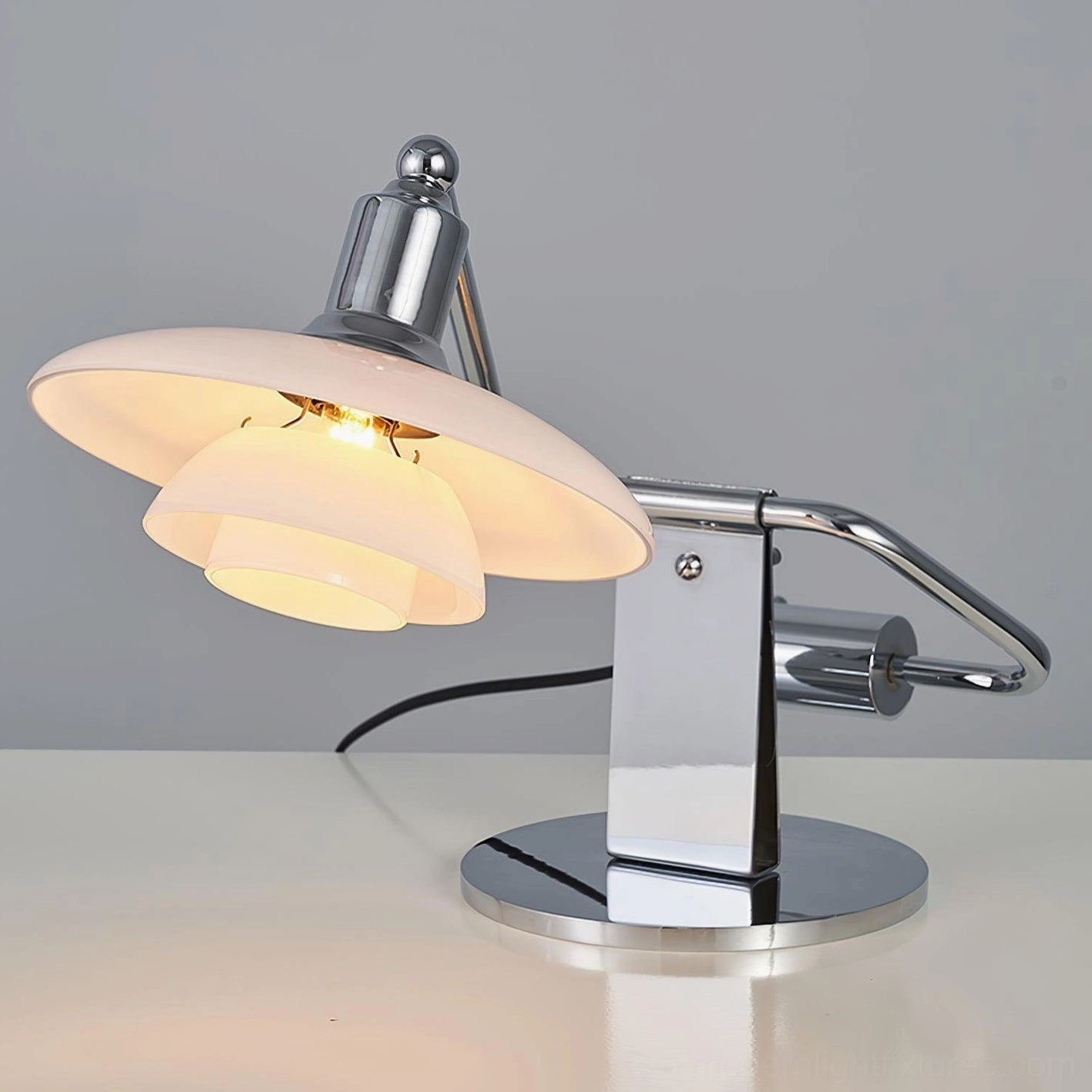 Poul table lamp three-tier frosted glass shade with high-polish chrome base and arm detail