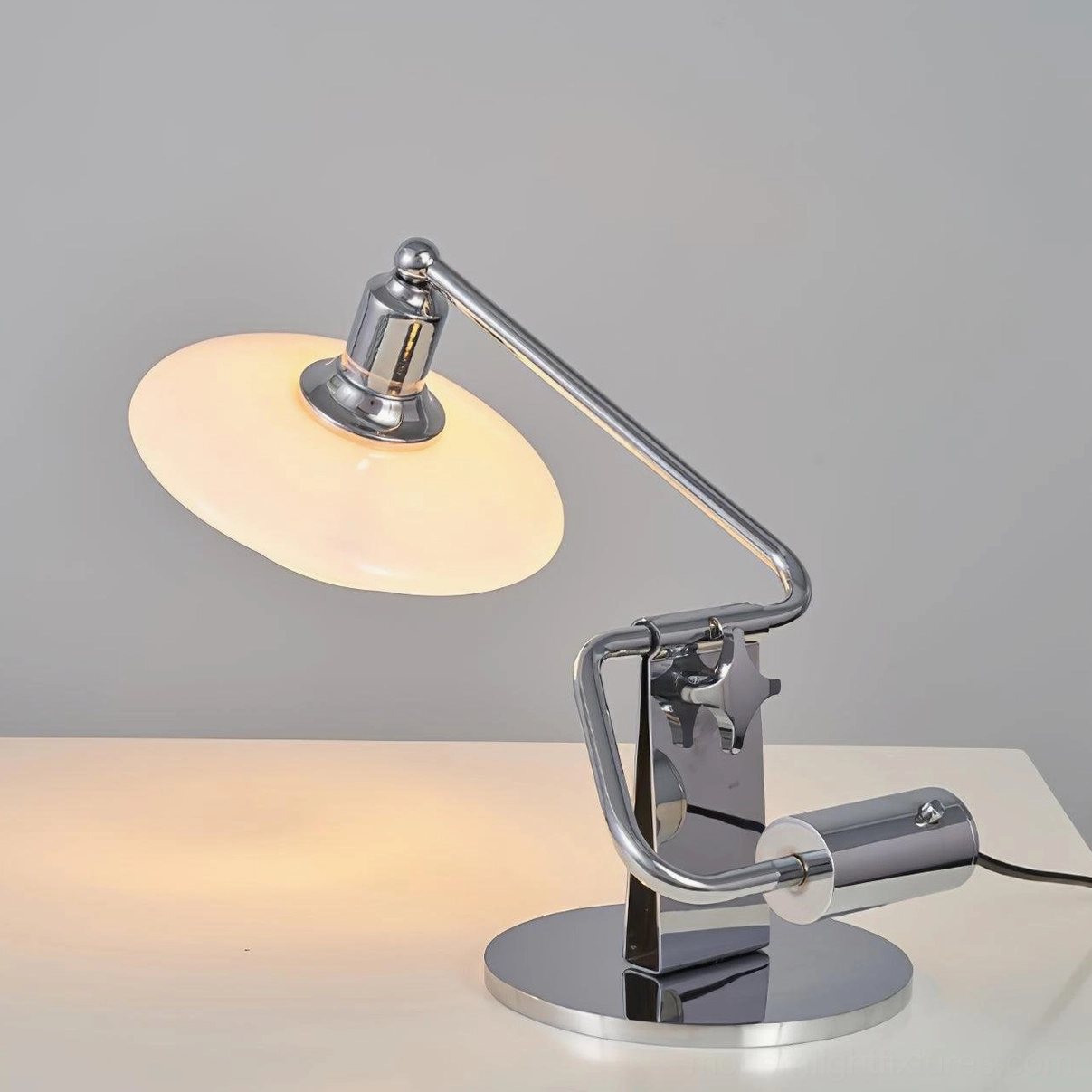 Poul table lamp with polished chrome hardware and frosted white glass shade architectural view