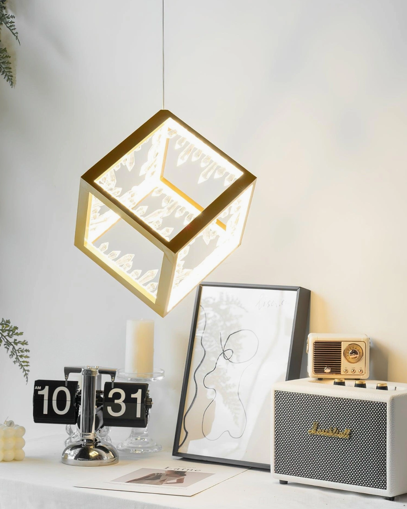 Modern cube pendant light with gold metal frame and precision-cut crystal panels
