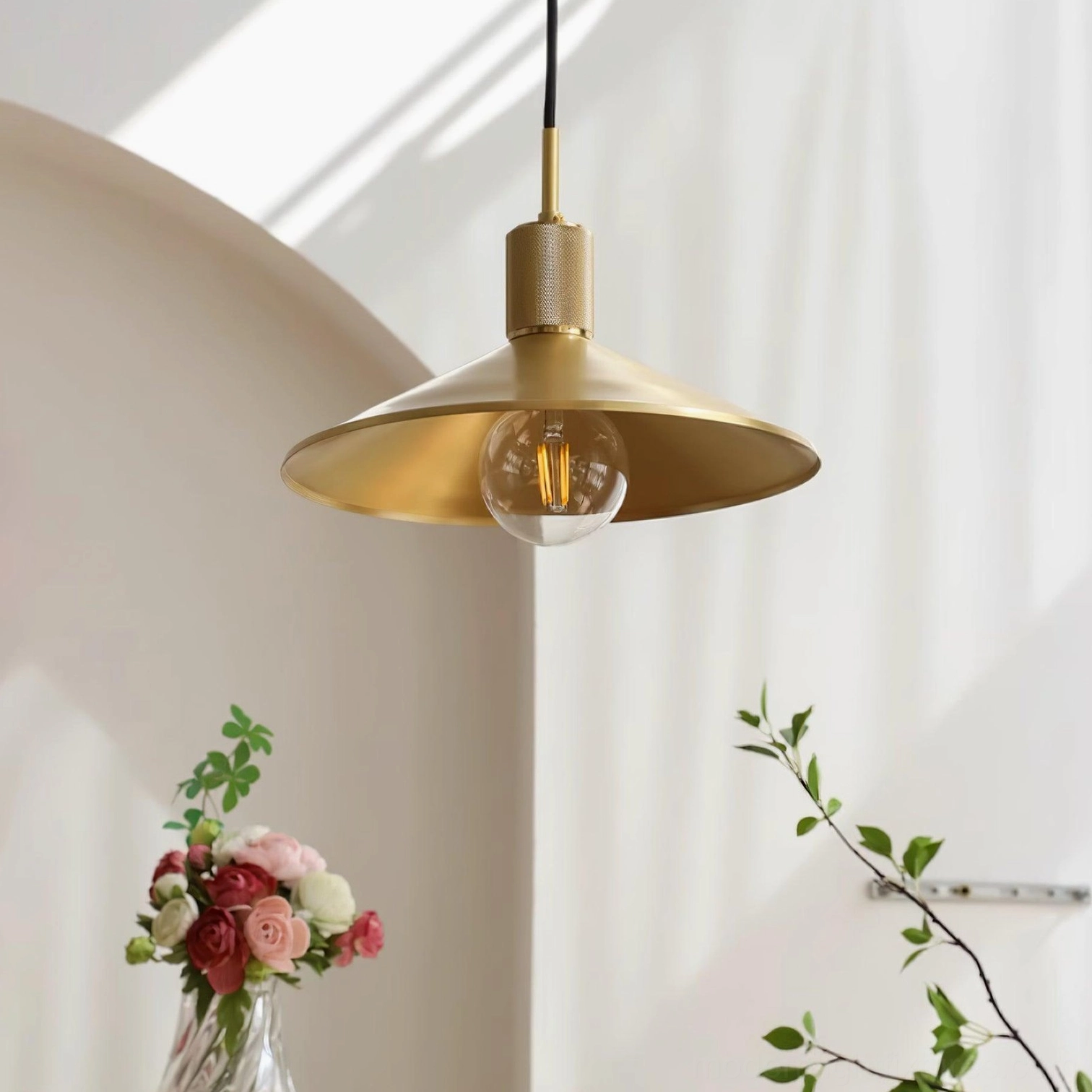 Premium brass pendant lamp with matte gold finish in contemporary minimalist home interior setting