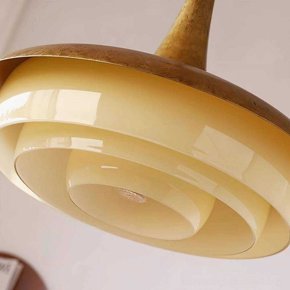 Premium brass pendant light with layered frosted glass shade, full-view product photography