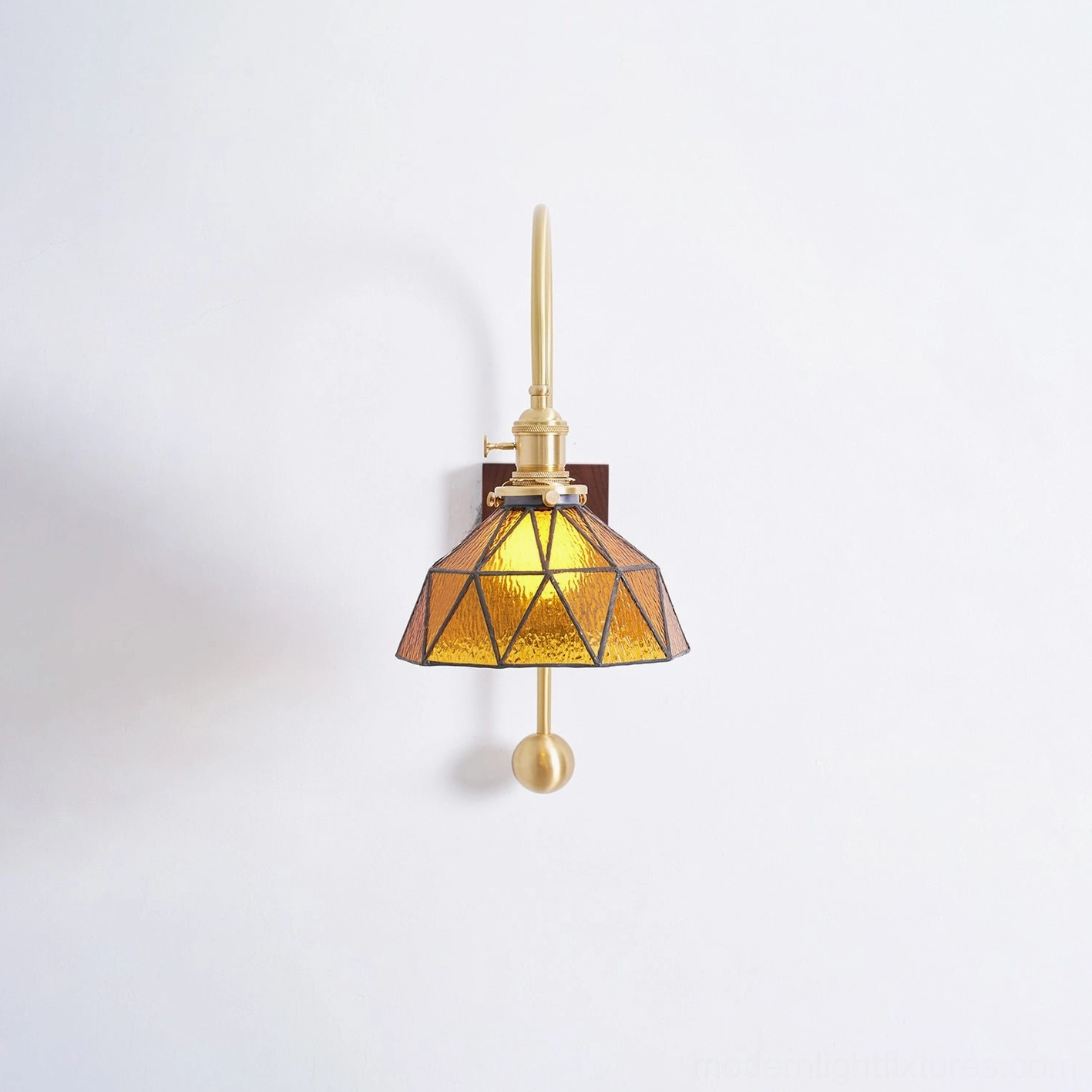 Premium brass wall sconce developing distinguished patina over time for character