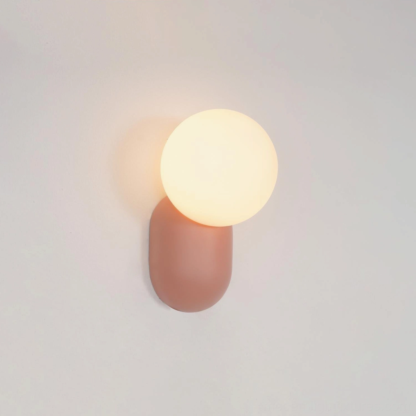 Modern spherical wall sconce detail showing premium resin material and refined aesthetic proportions