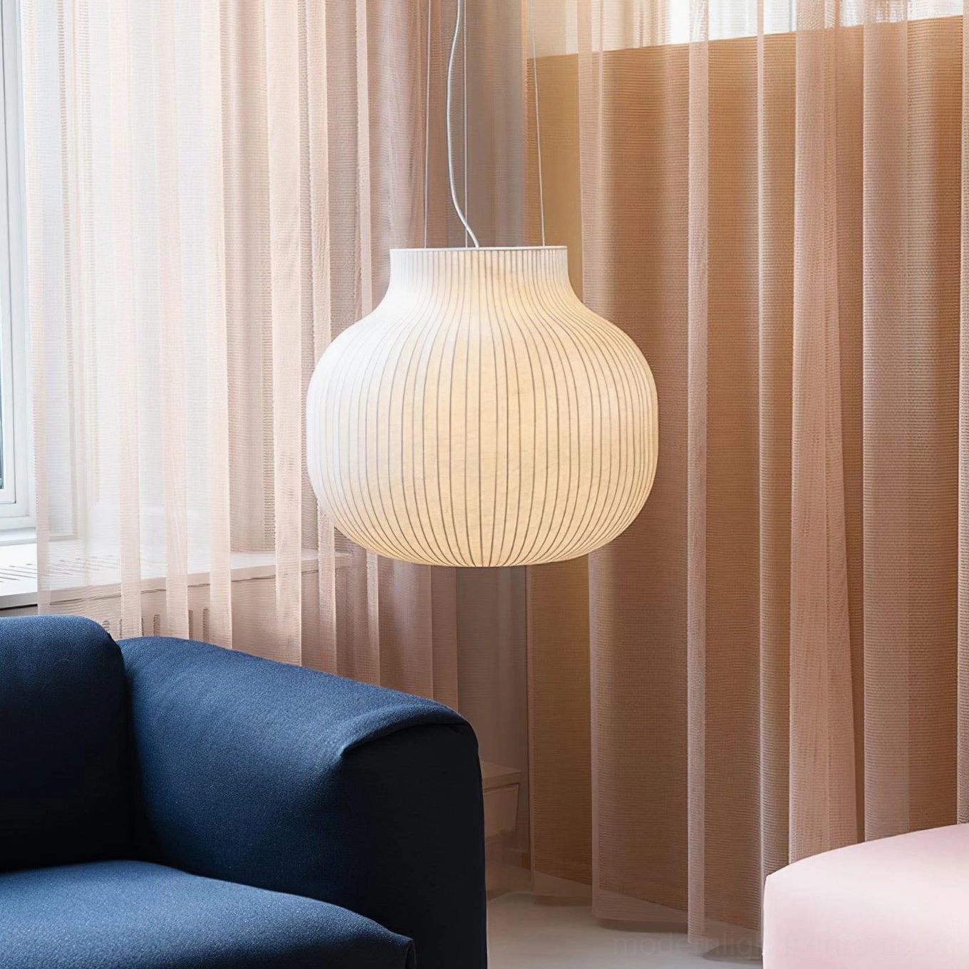 Ribbed cocoon pendant light showing intricate strand detail and premium craftsmanship