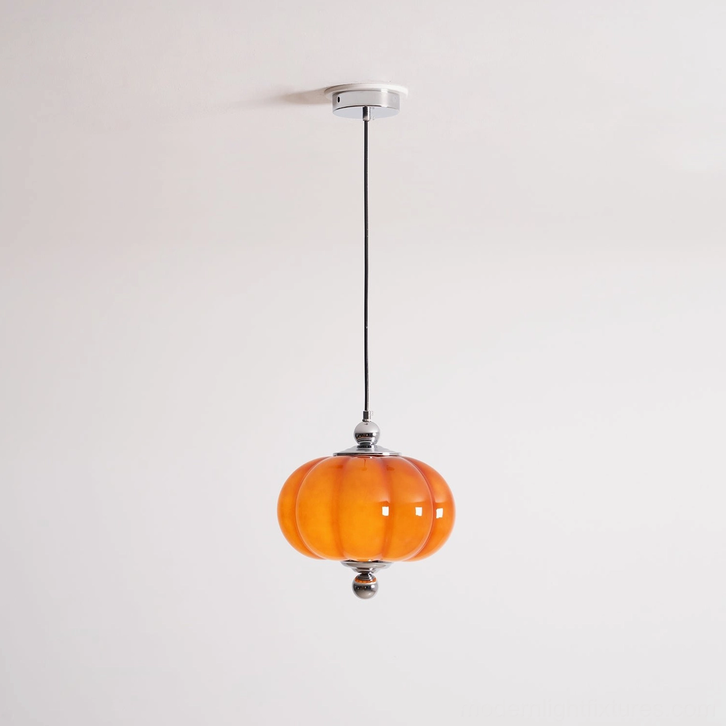 Pumpino handblown glass pendant light showing artistic craftsmanship and ribbed surface