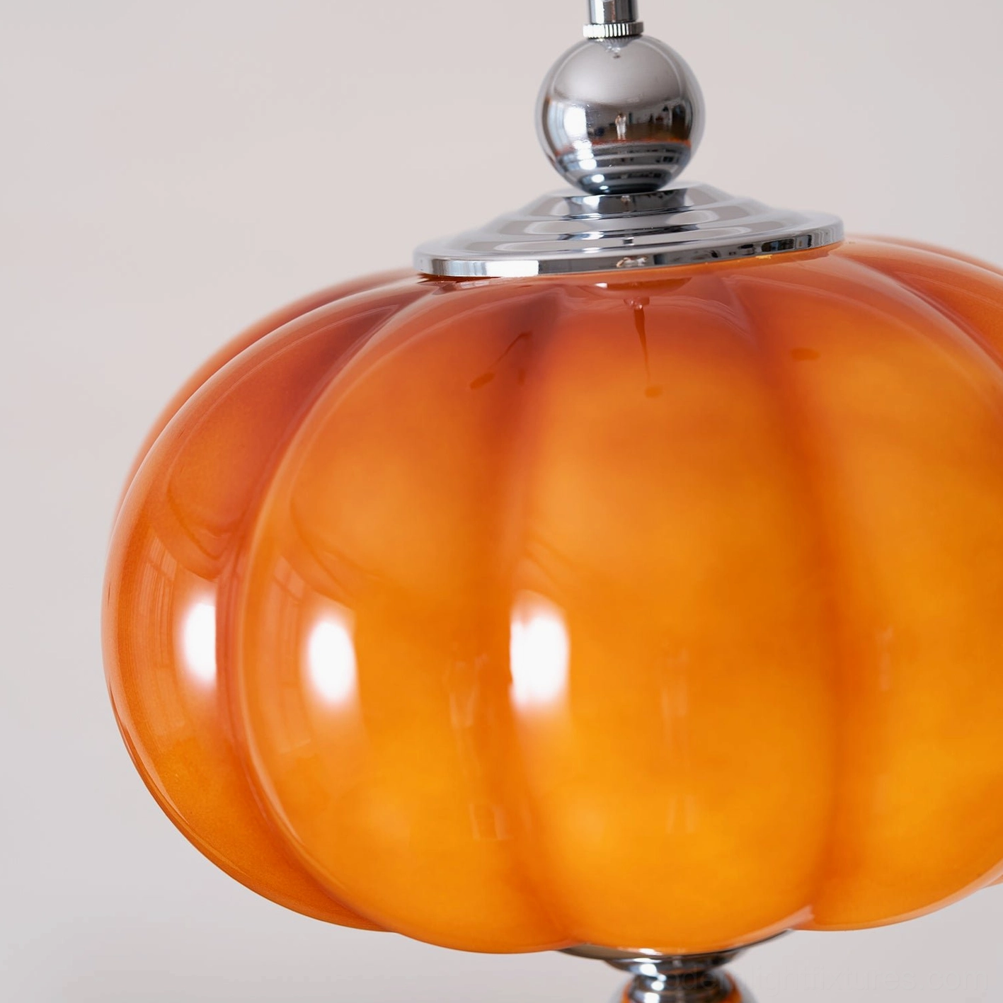Pumpino pendant light showing adjustable cord length and sloped ceiling compatibility