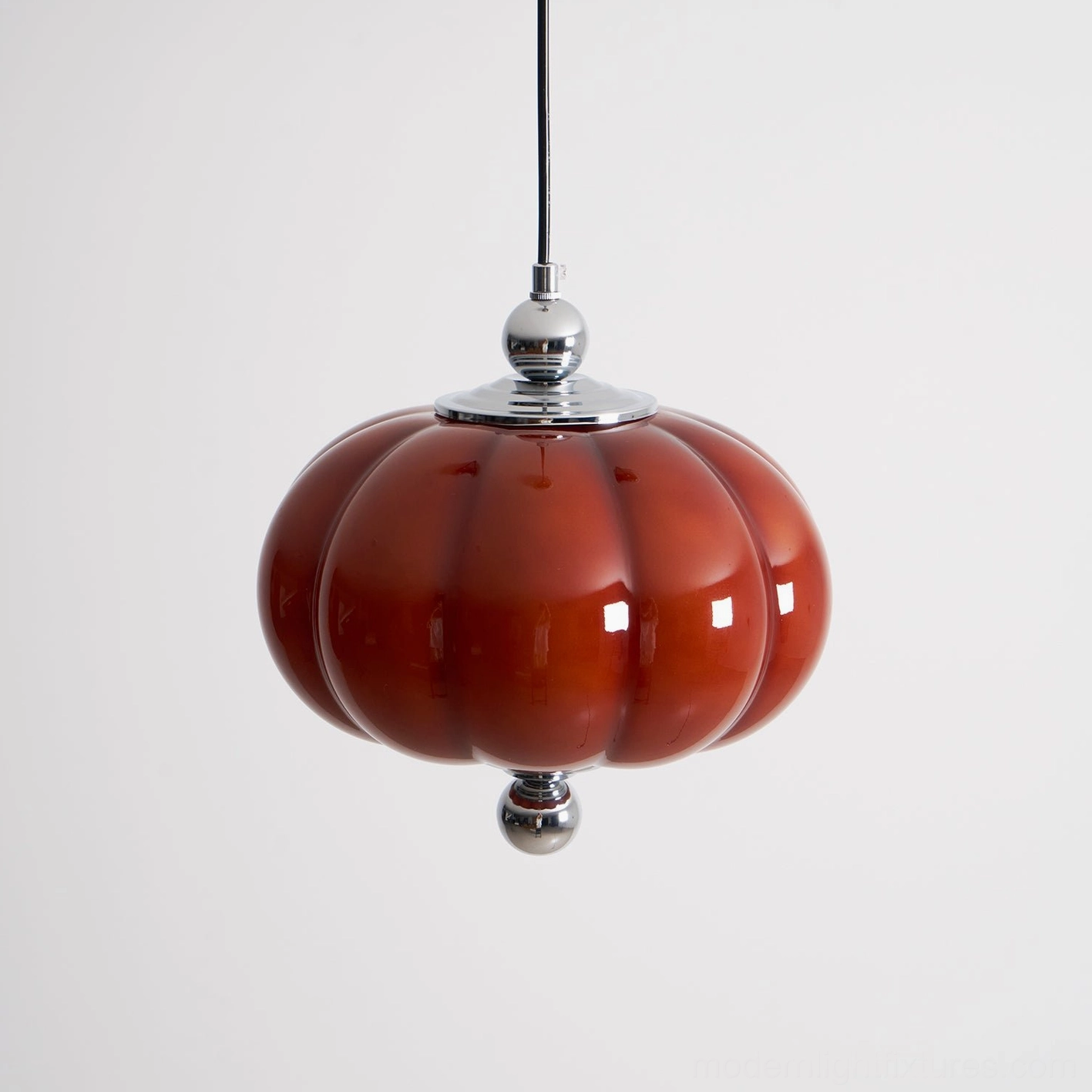 Pumpino red glass pendant light fixture with chrome accents in contemporary home decor