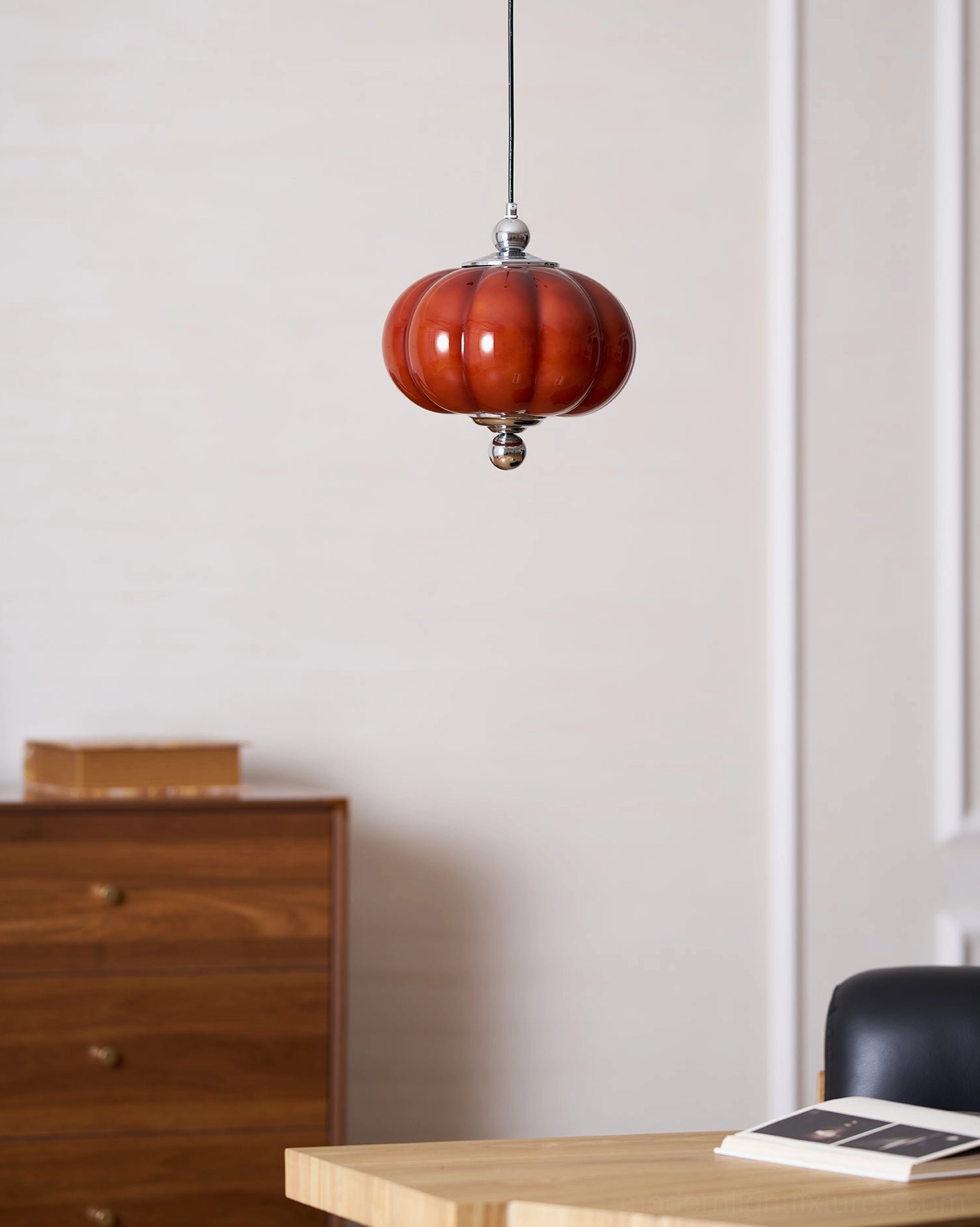Mini Pumpino red glass pendant lamp in contemporary home dining area with wooden furniture