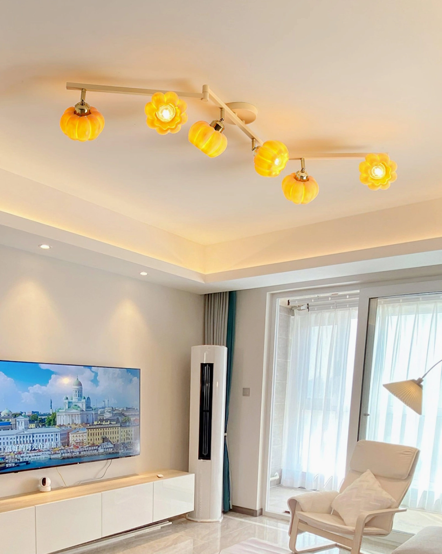 6-head pumpkin glass ceiling lamp with wood grain bracket, warm amber lighting in modern living room, branch silhouette design