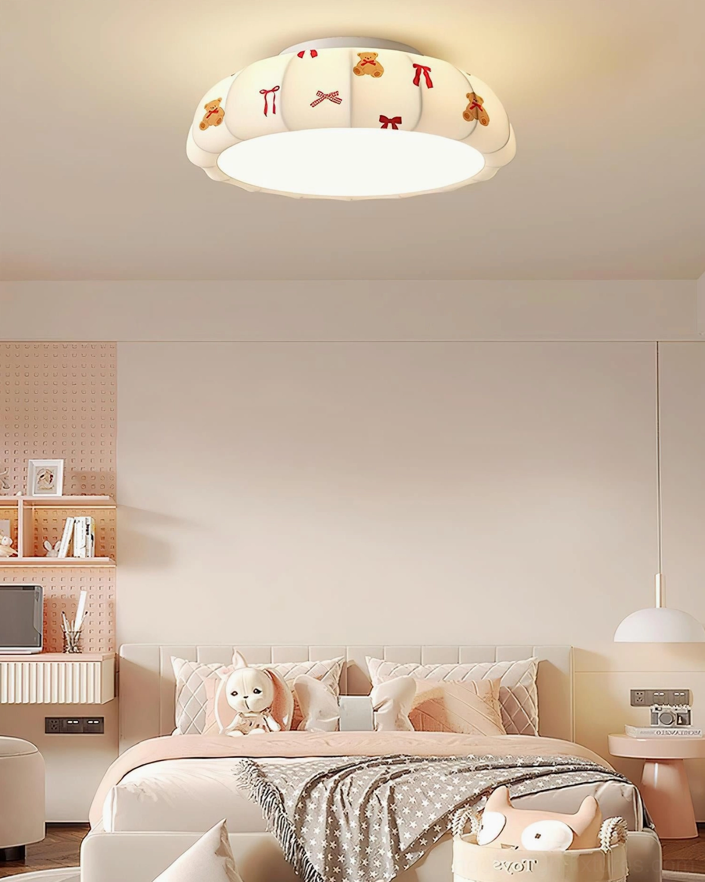 Pumpkin ceiling light in children's bedroom interior with blue cloud print shade and suspended hanging decoration creating warm ambient lighting