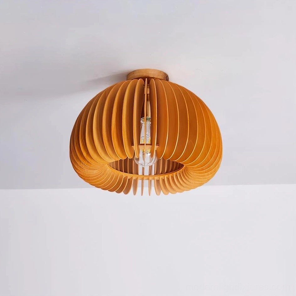 Large pumpkin ceiling light fixture creating dramatic lighting in living room space