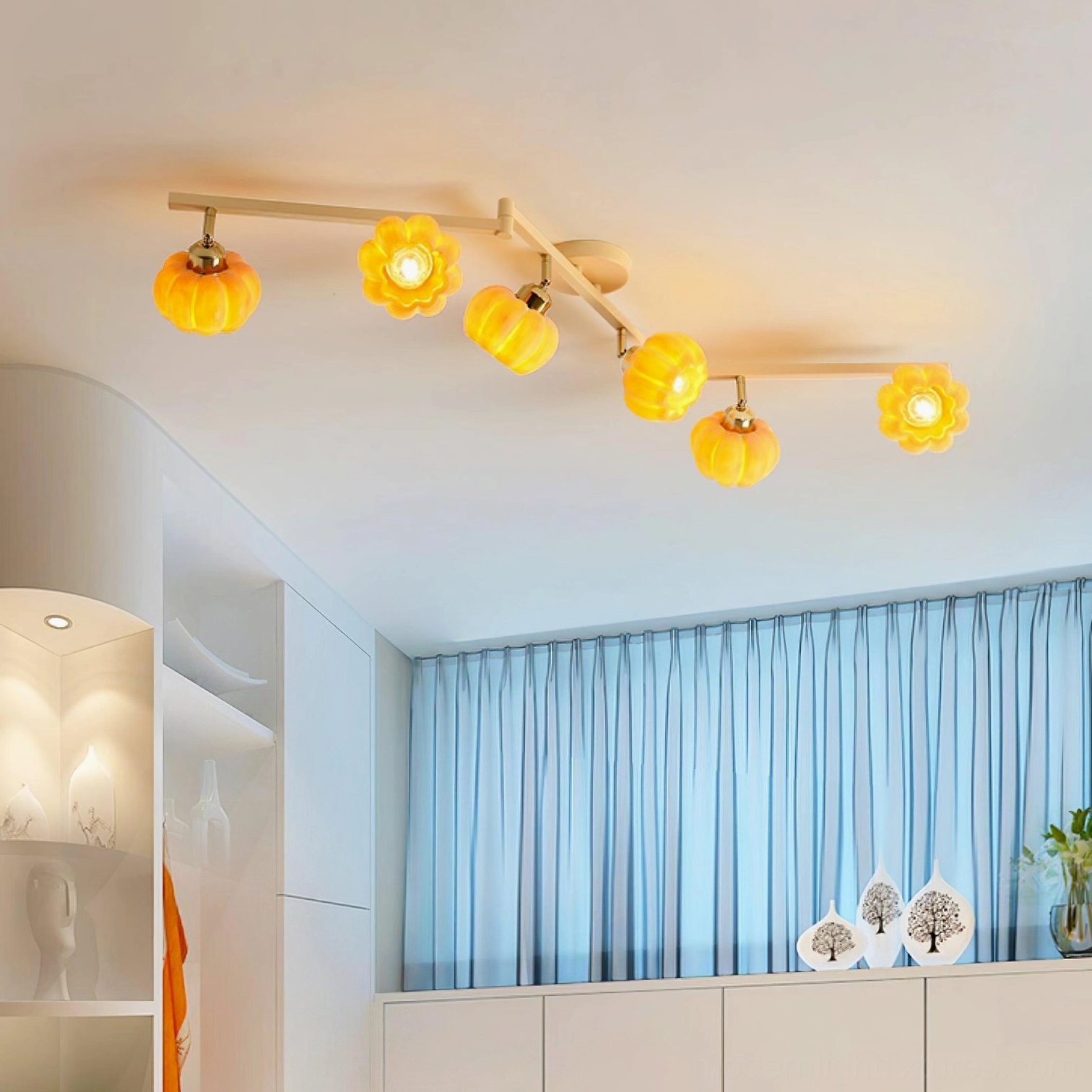 Mixed style 5-head ceiling lamp with flower and pumpkin glass shades, minimalist room with blue curtains, warm ambient lighting