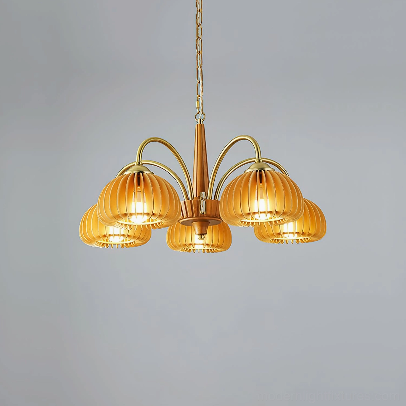 5-head pumpkin chandelier in warm living room setting showing fixture scale and presence