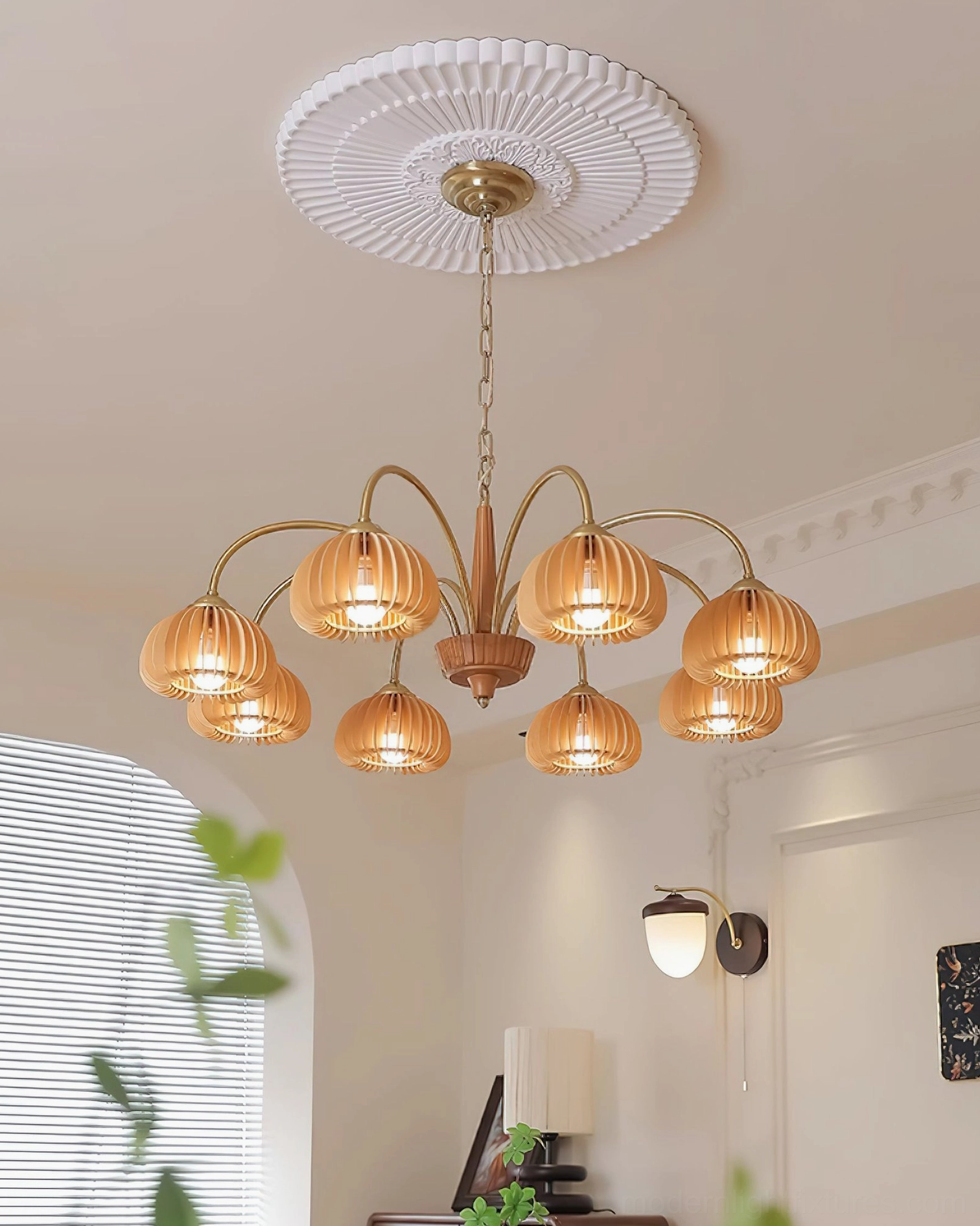 Pumpkin chandelier showing brass metal frame construction and wood tone accents