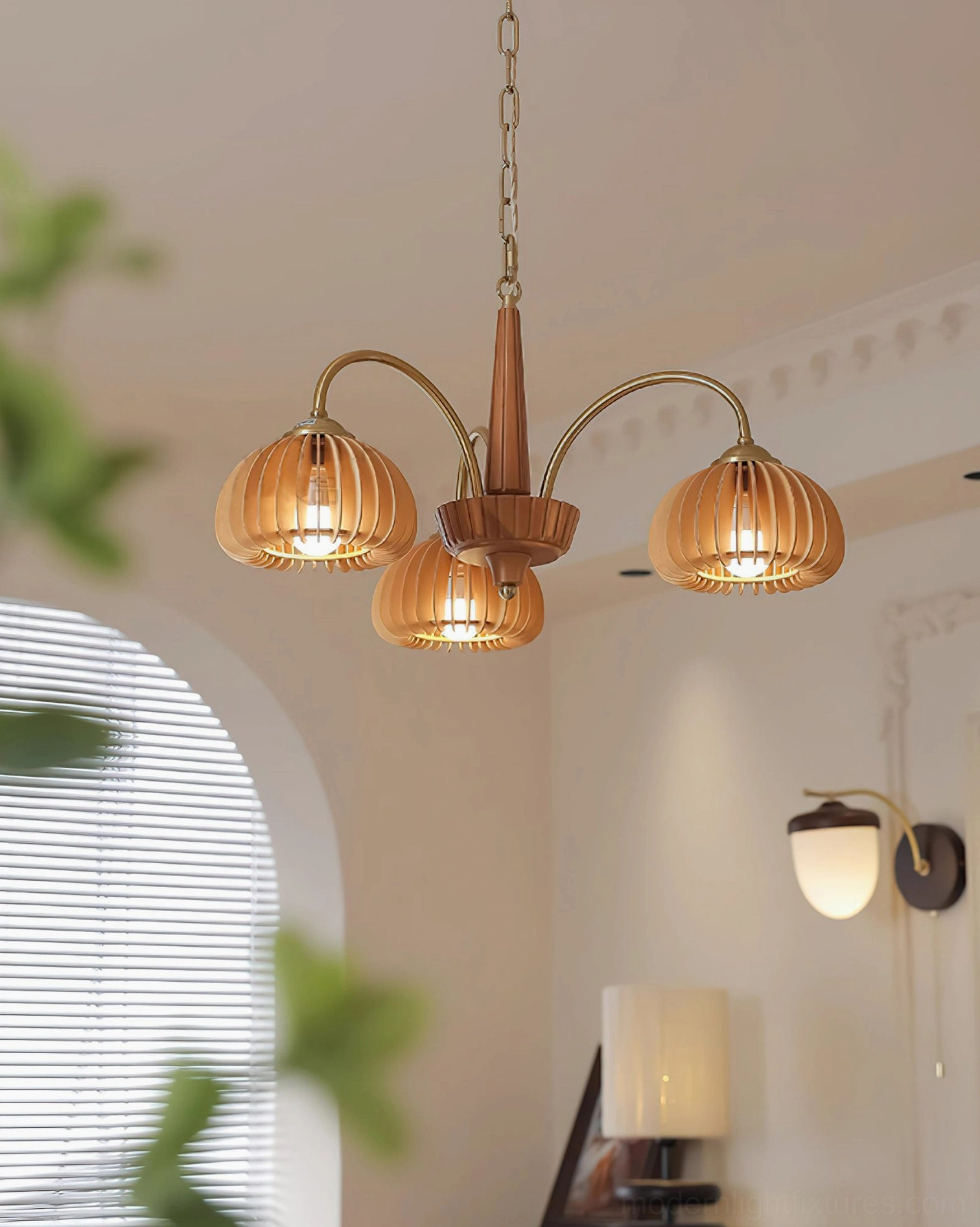 Vintage pumpkin ribbed glass chandelier illuminated showing harvest season aesthetic
