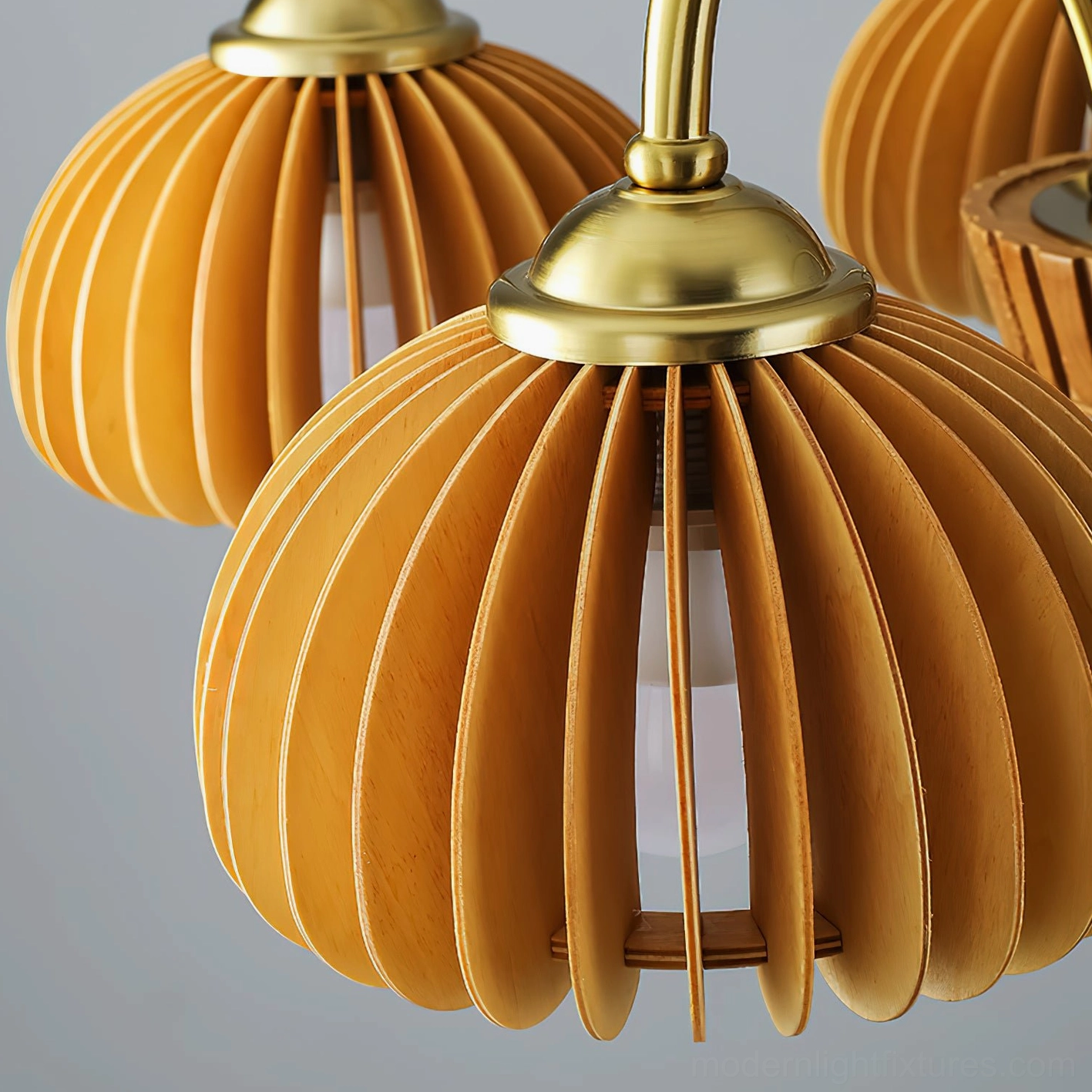 Pumpkin chandelier overview showing ribbed golden glass shade design and metal framework