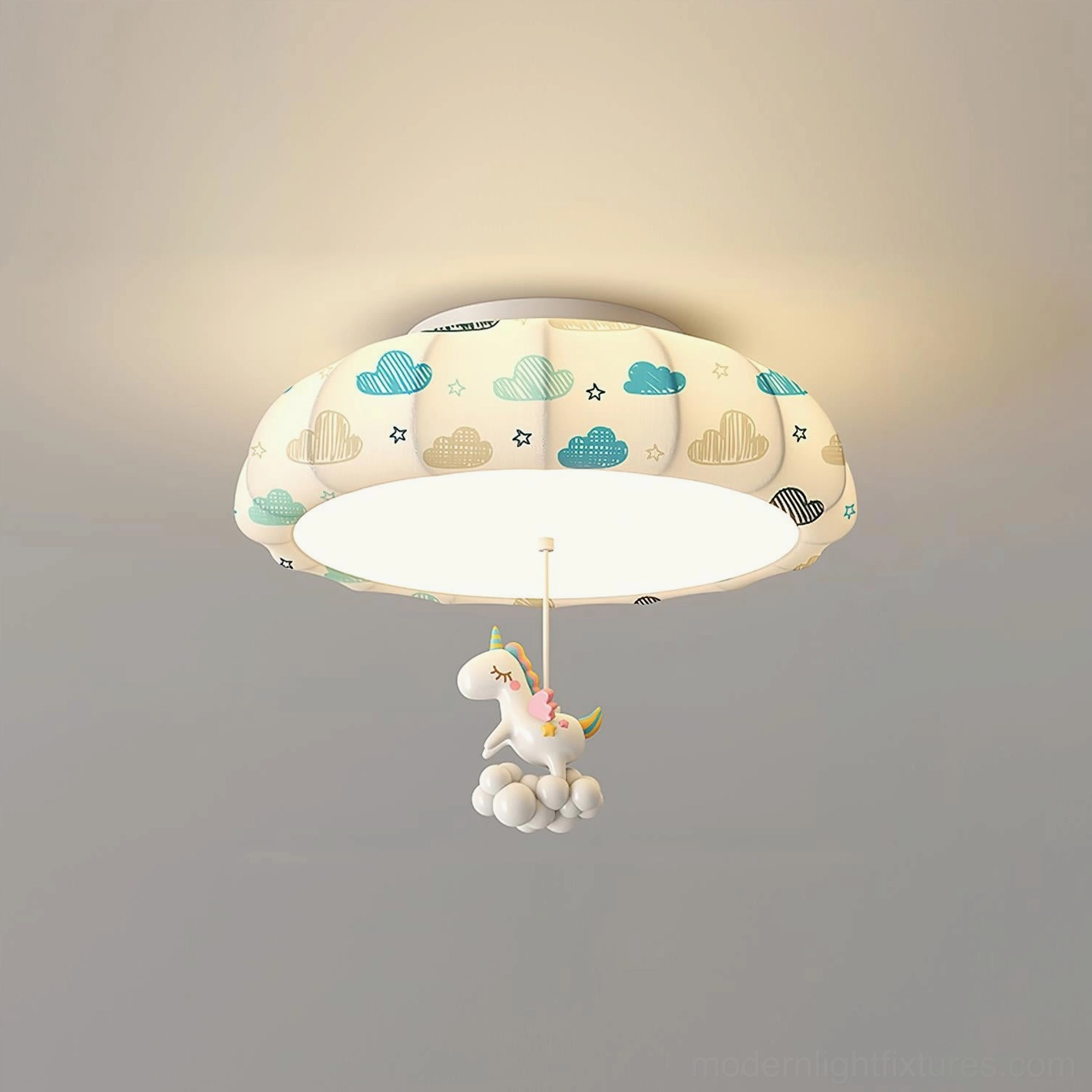 Close-up front view of pumpkin ceiling light with blue cloud print pattern and suspended unicorn character decor on neutral background