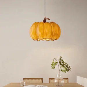 Pumpkin hanging lamp overhead angle showing scalloped rim detail in minimalist dining room