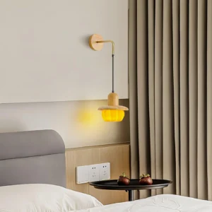 Pumpkin wall sconce bedside installation in cozy bedroom corner with grey fabric bed, Japandi ambient lighting setup