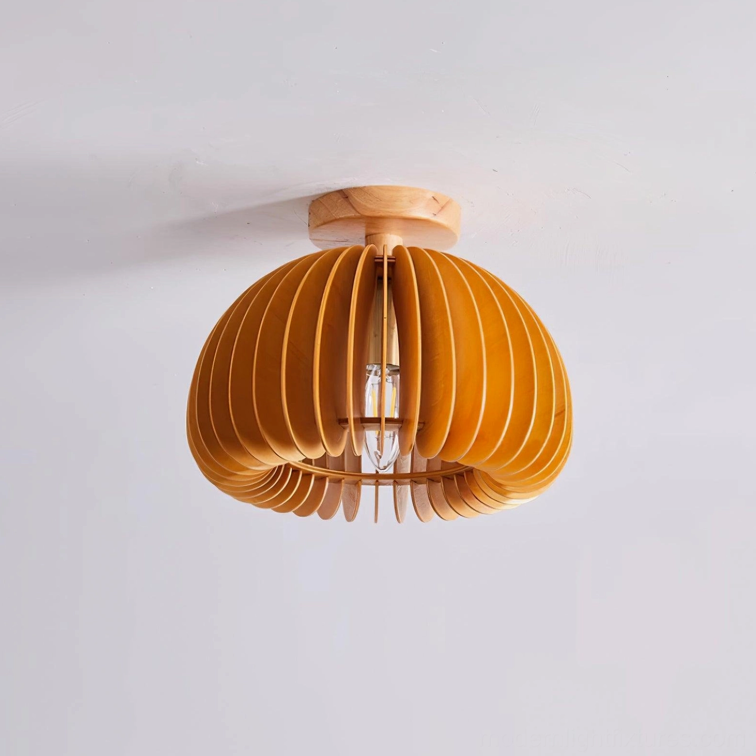 Detailed side view of wooden pumpkin ceiling light showing basswood construction and grain texture