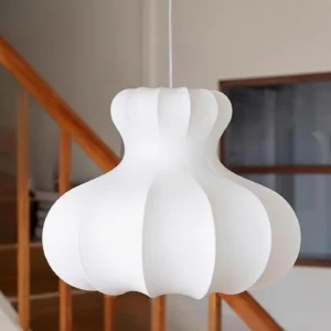 Matte white Pumpora gourd-shaped pendant lamp with ribbed texture hanging in modern interior stairwell