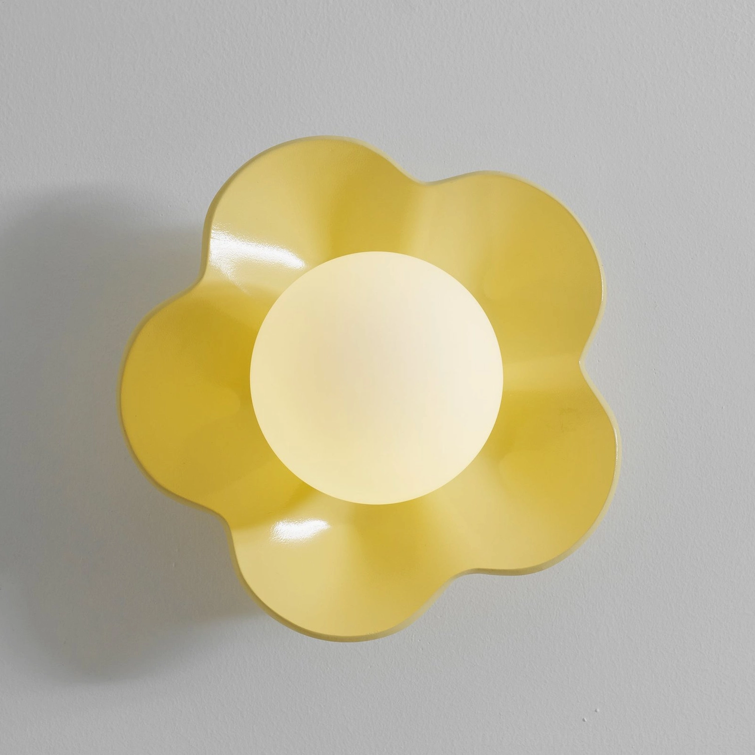 Purple Fleur wall lamp dramatic accent lighting - theatrical resin flower sconce creates atmospheric focal point
