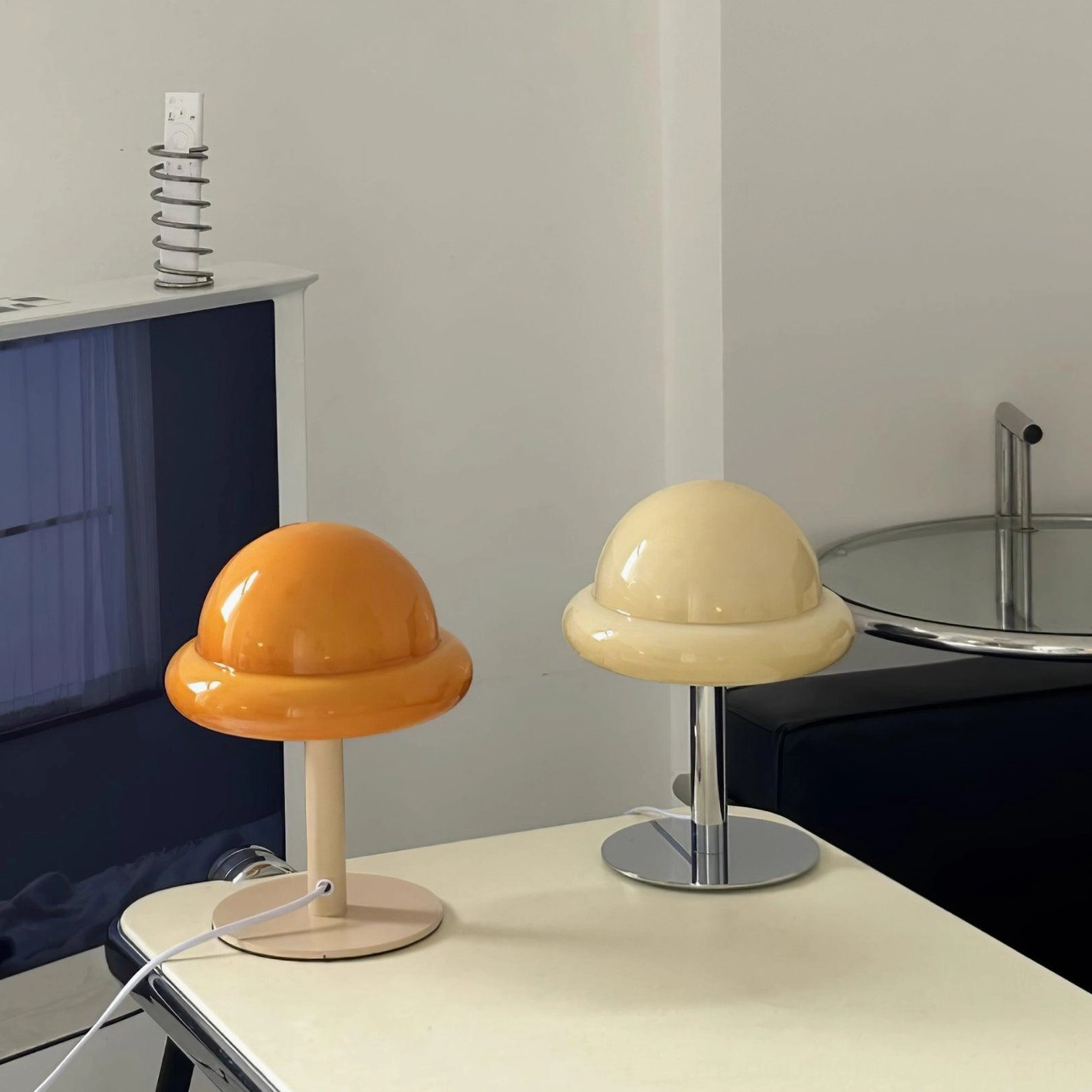 Purple glossy glass mushroom dome lamp with chrome base on contemporary furniture