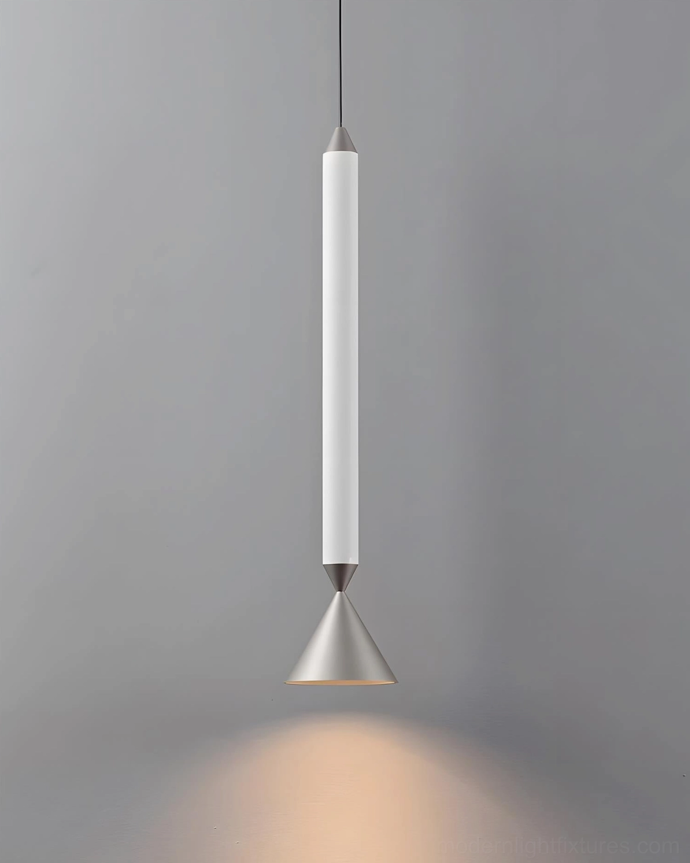 Pylon pendant light fixture mounted in modern minimalist interior space, integrated LED warm white illumination